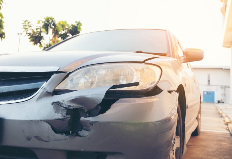 Front side of accident car. Car crash accident damaged automobiles after collision in city