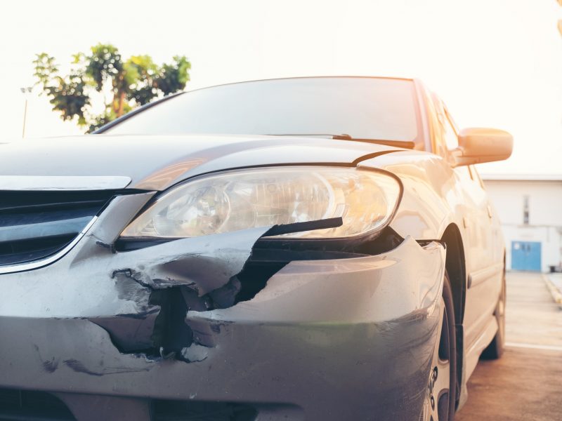 Front side of accident car. Car crash accident damaged automobiles after collision in city